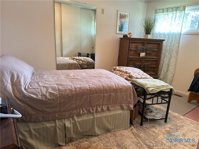 5916 E Benalex Dr, Toledo, OH 43612 - carpeted bedroom with a closet