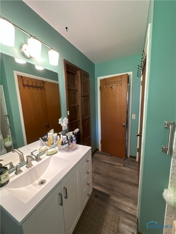 5916 E Benalex Dr, Toledo, OH 43612 - full bathroom with vanity and wood finished floors