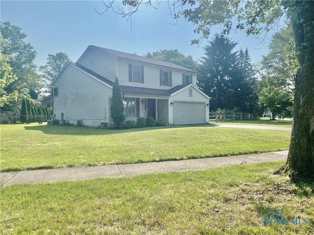 3800 Harrowsfield Rd, Sylvania, OH 43560 - traditional home featuring concrete driveway, a garage, and a front lawn