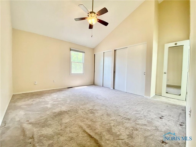 3800 Harrowsfield Rd, Sylvania, OH 43560 - unfurnished bedroom with multiple closets, carpet floors, high vaulted ceiling, and a ceiling fan