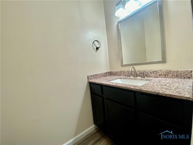 3800 Harrowsfield Rd, Sylvania, OH 43560 - bathroom featuring vanity and wood finished floors