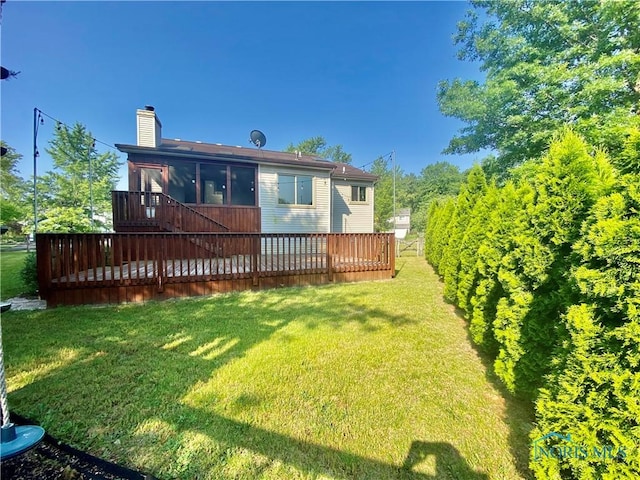 3800 Harrowsfield Rd, Sylvania, OH 43560 - rear view of house with a wooden deck, a chimney, a lawn, and stairs