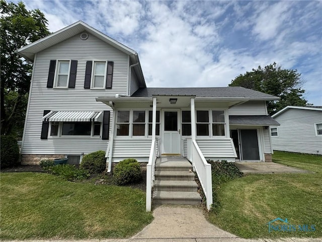201 E Rings St, West Unity, OH 43570 - view of front of property with a front lawn and a shingled roof