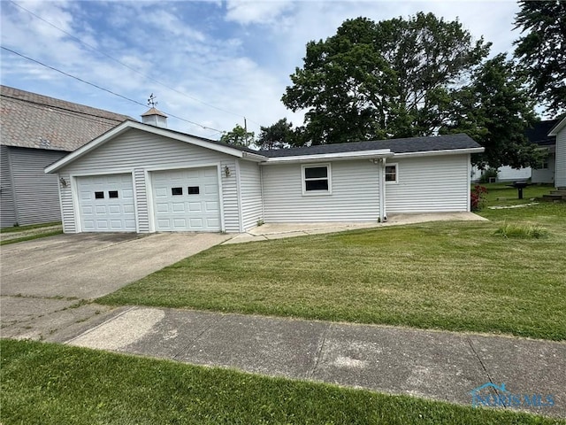 201 E Rings St, West Unity, OH 43570 - view of property exterior featuring a yard and a garage