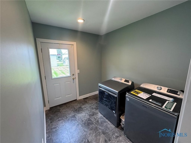 201 E Rings St, West Unity, OH 43570 - laundry room with washer and clothes dryer and baseboards