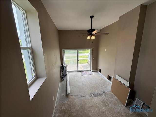 201 E Rings St, West Unity, OH 43570 - unfurnished living room featuring baseboards and a ceiling fan