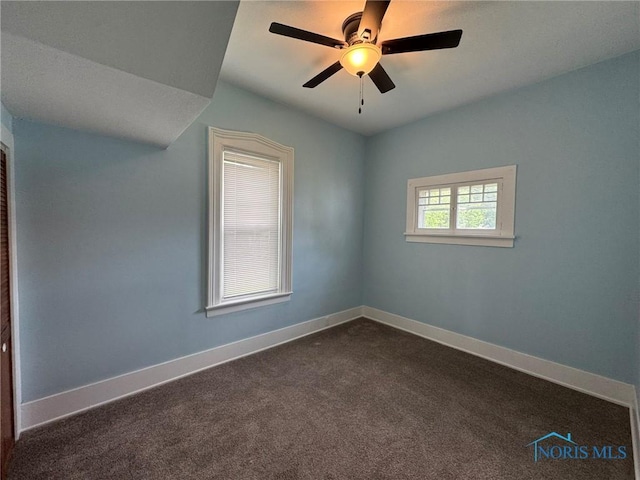 201 E Rings St, West Unity, OH 43570 - spare room featuring dark colored carpet and ceiling fan