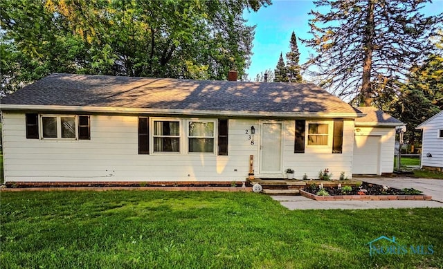 238 Richards Rd, Toledo, OH 43607 - ranch-style house with a front yard, a garage, and concrete driveway