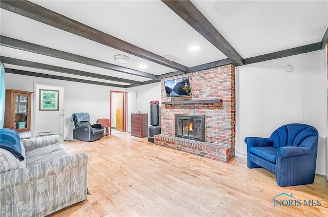 238 Richards Rd, Toledo, OH 43607 - living room with a fireplace, wood finished floors, beam ceiling, and a baseboard heating unit