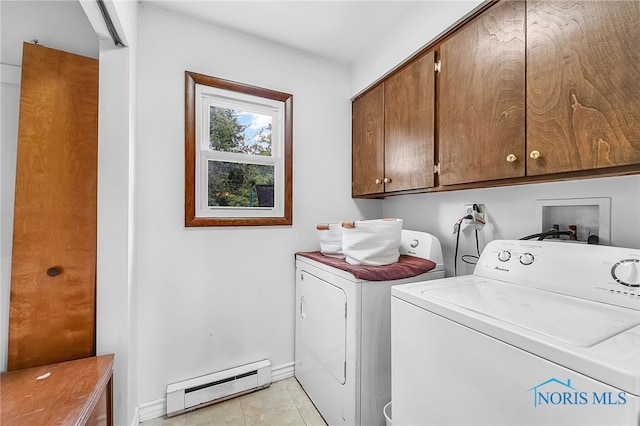 238 Richards Rd, Toledo, OH 43607 - washroom featuring a baseboard radiator, cabinet space, washer and dryer, and light tile patterned floors