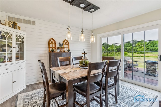 4220 N County Road 33, Tiffin, OH 44883 - dining room featuring light wood-style flooring and wooden walls