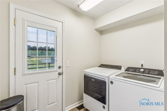 4220 N County Road 33, Tiffin, OH 44883 - laundry area with washer and clothes dryer and baseboards