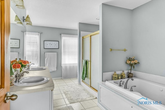 5872 Settlers Ridge Cir, Sylvania, OH 43560 - bathroom with a stall shower, a garden tub, double vanity, and tile patterned floors