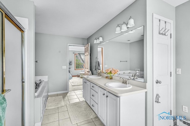 5872 Settlers Ridge Cir, Sylvania, OH 43560 - full bath with double vanity, a bath, tile patterned floors, and baseboard heating