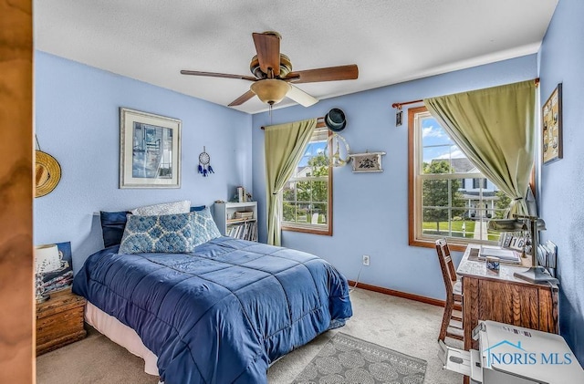 5872 Settlers Ridge Cir, Sylvania, OH 43560 - carpeted bedroom featuring ceiling fan, a desk, and a textured ceiling