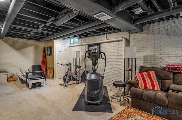 5872 Settlers Ridge Cir, Sylvania, OH 43560 - workout area featuring brick wall