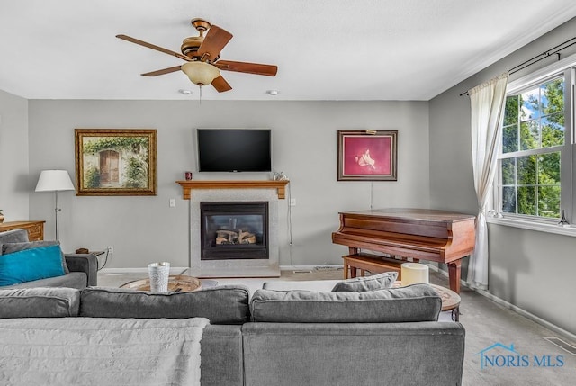 5872 Settlers Ridge Cir, Sylvania, OH 43560 - living room featuring a ceiling fan, a glass covered fireplace, and carpet floors