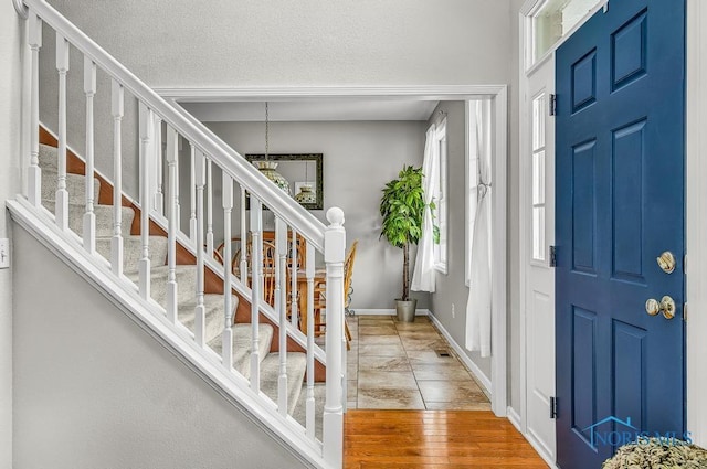 5872 Settlers Ridge Cir, Sylvania, OH 43560 - foyer entrance featuring stairs and baseboards