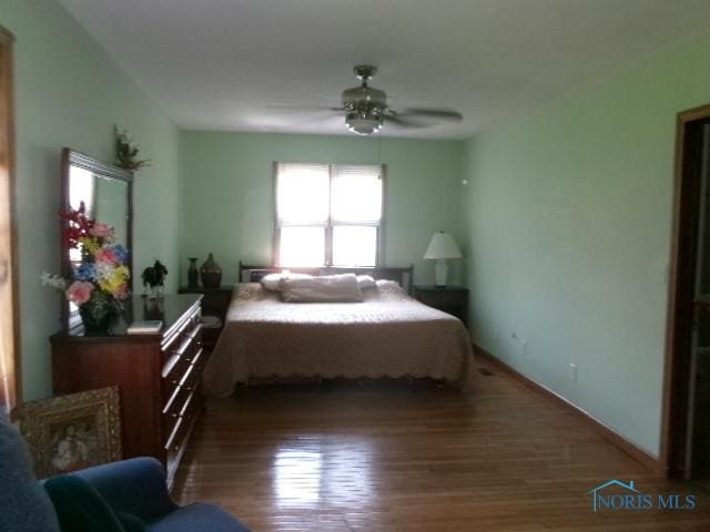 252 N Walnut St, Ottawa, OH 45875 - bedroom featuring wood finished floors and a ceiling fan
