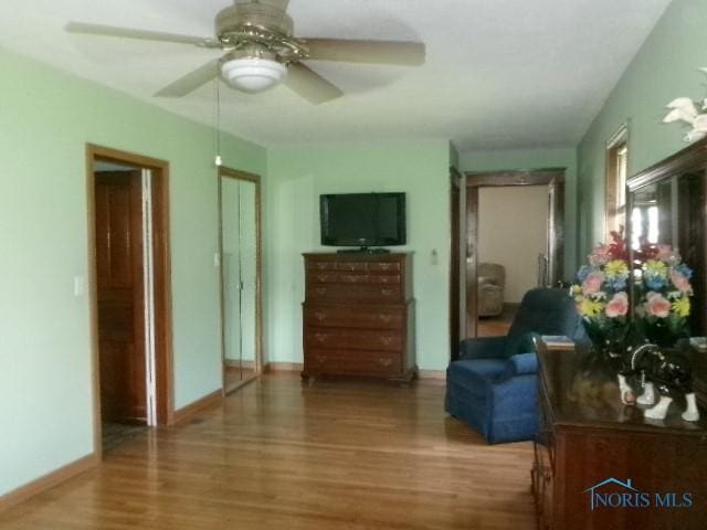 252 N Walnut St, Ottawa, OH 45875 - living room with wood finished floors and ceiling fan