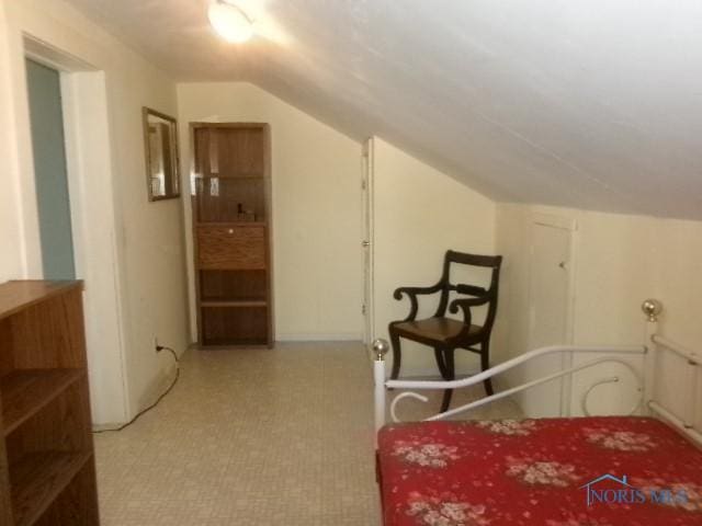 252 N Walnut St, Ottawa, OH 45875 - bedroom with tile patterned floors and lofted ceiling