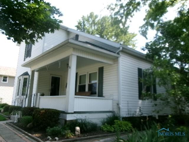 252 N Walnut St, Ottawa, OH 45875 - view of property exterior with a porch