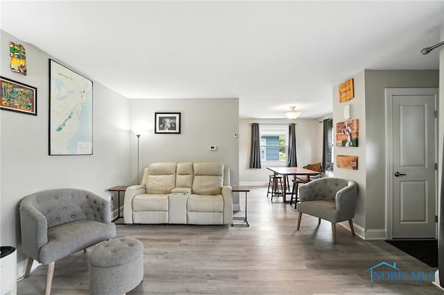 1022 Clough St, Bowling Green, OH 43402 - living area featuring wood finished floors and baseboards