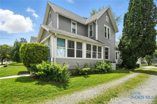 418 S Grove St, Bowling Green, OH 43402 - view of side of home featuring a lawn, a shingled roof, and driveway