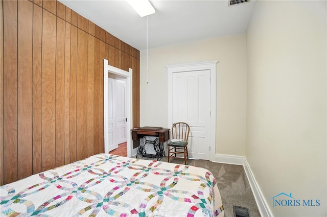 418 S Grove St, Bowling Green, OH 43402 - bedroom with carpet flooring and wooden walls