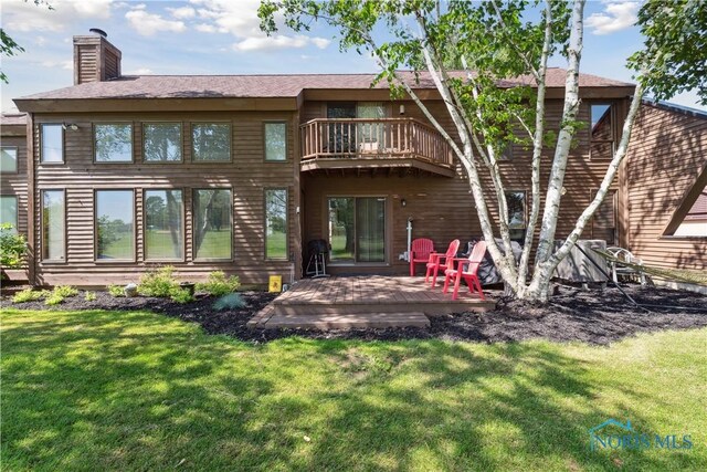 23866 W State Route 579, Curtice, OH 43412 - back of property with a chimney, a balcony, a lawn, and a deck
