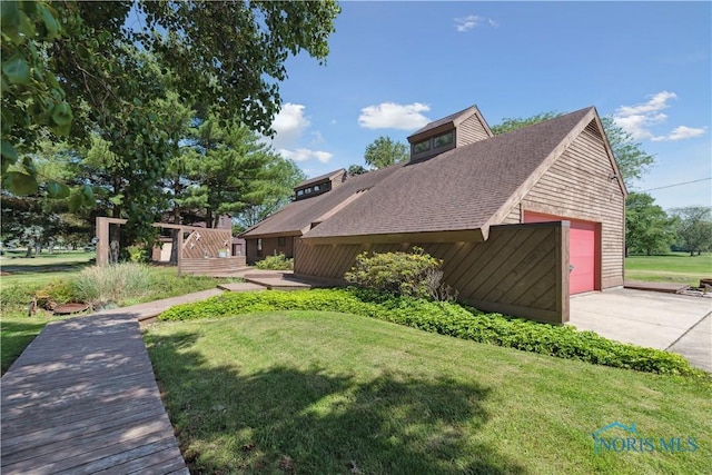 23866 W State Route 579, Curtice, OH 43412 - view of home's exterior with a lawn, a garage, a shingled roof, a deck, and driveway