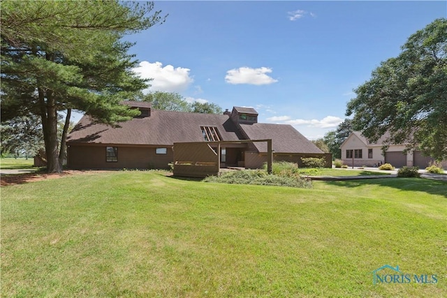 23866 W State Route 579, Curtice, OH 43412 - back of house featuring a lawn