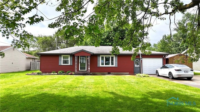 825 Johnson Rd, Paulding, OH 45879 - ranch-style house with driveway, an attached garage, and a front lawn