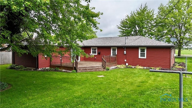825 Johnson Rd, Paulding, OH 45879 - rear view of house with a deck and roof with shingles