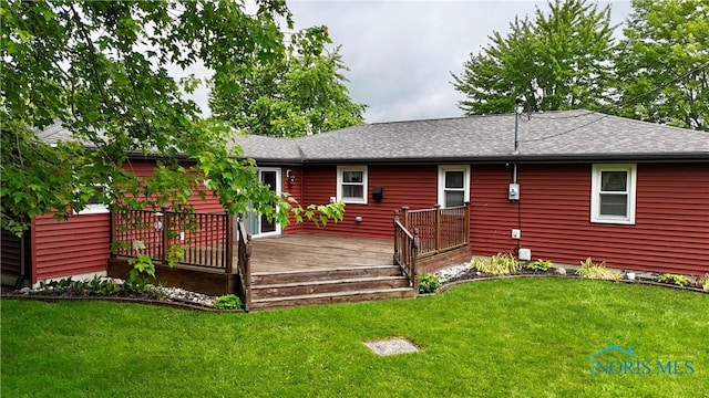 825 Johnson Rd, Paulding, OH 45879 - rear view of house with a deck, a yard, and roof with shingles