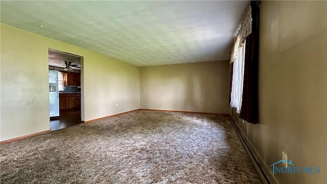 825 Johnson Rd, Paulding, OH 45879 - carpeted empty room featuring baseboards and a textured ceiling