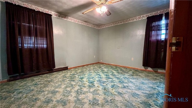 825 Johnson Rd, Paulding, OH 45879 - carpeted empty room featuring ceiling fan and baseboards