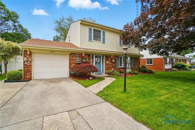 1309 Gettysburg Dr, Maumee, OH 43537 - traditional home featuring driveway, a front lawn, a garage, and brick siding