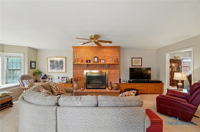 1309 Gettysburg Dr, Maumee, OH 43537 - living room featuring light colored carpet, a ceiling fan, and a fireplace