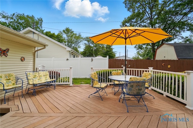 1309 Gettysburg Dr, Maumee, OH 43537 - wooden terrace with outdoor dining area and a fenced backyard