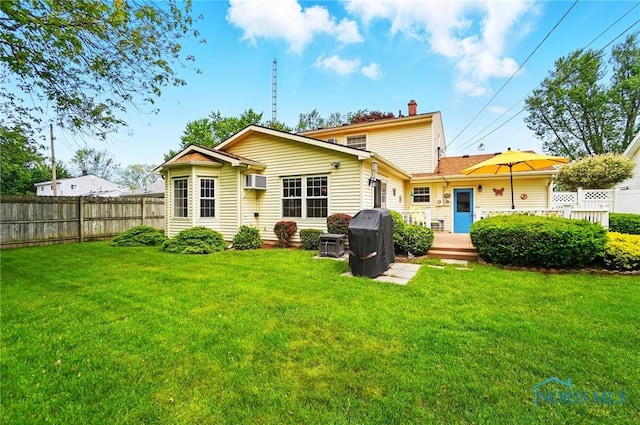 1309 Gettysburg Dr, Maumee, OH 43537 - back of house featuring a wooden deck, an AC wall unit, and a chimney