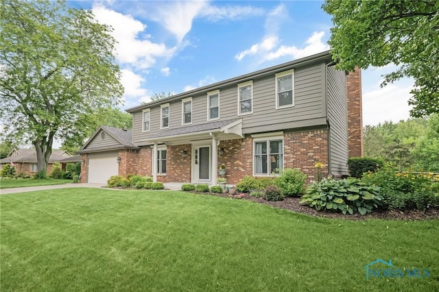 7040 Country Creek Rd, Maumee, OH 43537 - view of front of home featuring brick siding, a front yard, an attached garage, a chimney, and driveway