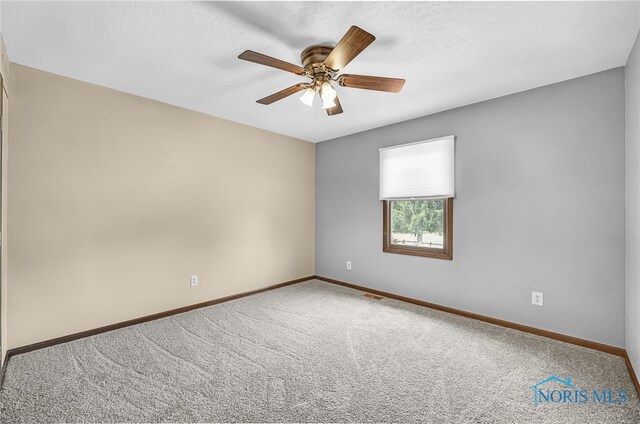 7040 Country Creek Rd, Maumee, OH 43537 - spare room featuring carpet flooring and a ceiling fan