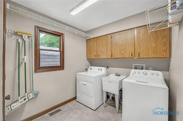 7040 Country Creek Rd, Maumee, OH 43537 - laundry area featuring cabinet space and independent washer and dryer