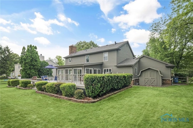 7040 Country Creek Rd, Maumee, OH 43537 - back of house featuring a storage shed, a sunroom, and a chimney