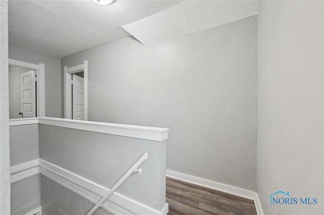 2336 Caledonia St, Toledo, OH 43605 - corridor with wood finished floors and an upstairs landing