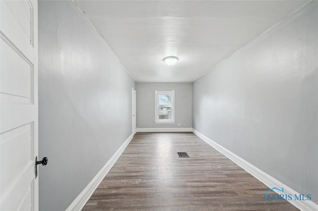 2336 Caledonia St, Toledo, OH 43605 - unfurnished room featuring wood finished floors and baseboards