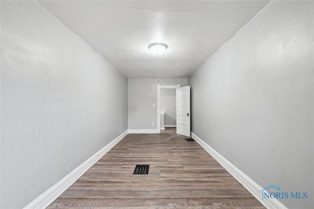 2336 Caledonia St, Toledo, OH 43605 - spare room featuring wood finished floors and baseboards