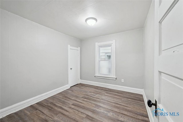 2336 Caledonia St, Toledo, OH 43605 - empty room with wood finished floors and baseboards