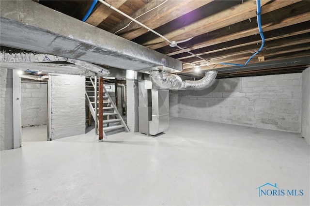 2336 Caledonia St, Toledo, OH 43605 - unfinished basement with heating unit and stairs
